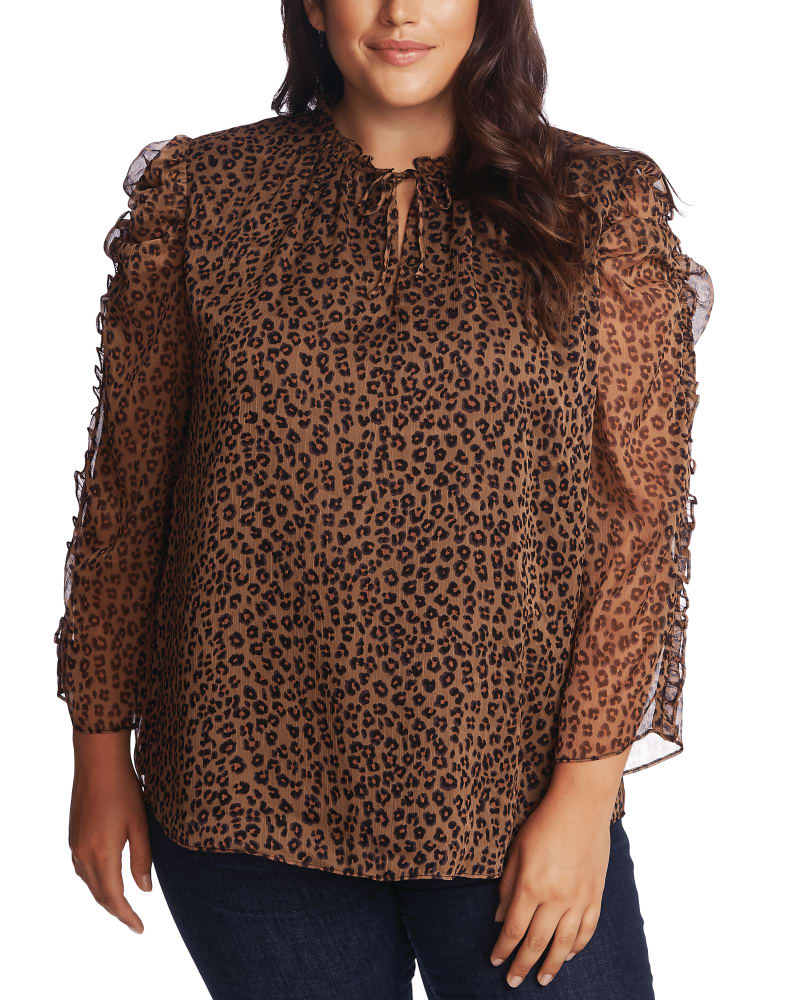 Front of a model wearing a size 1X Emery Ruffled Animal-Print Blouse in 263-SPICEWOOD by CeCe. | dia_product_style_image_id:263360